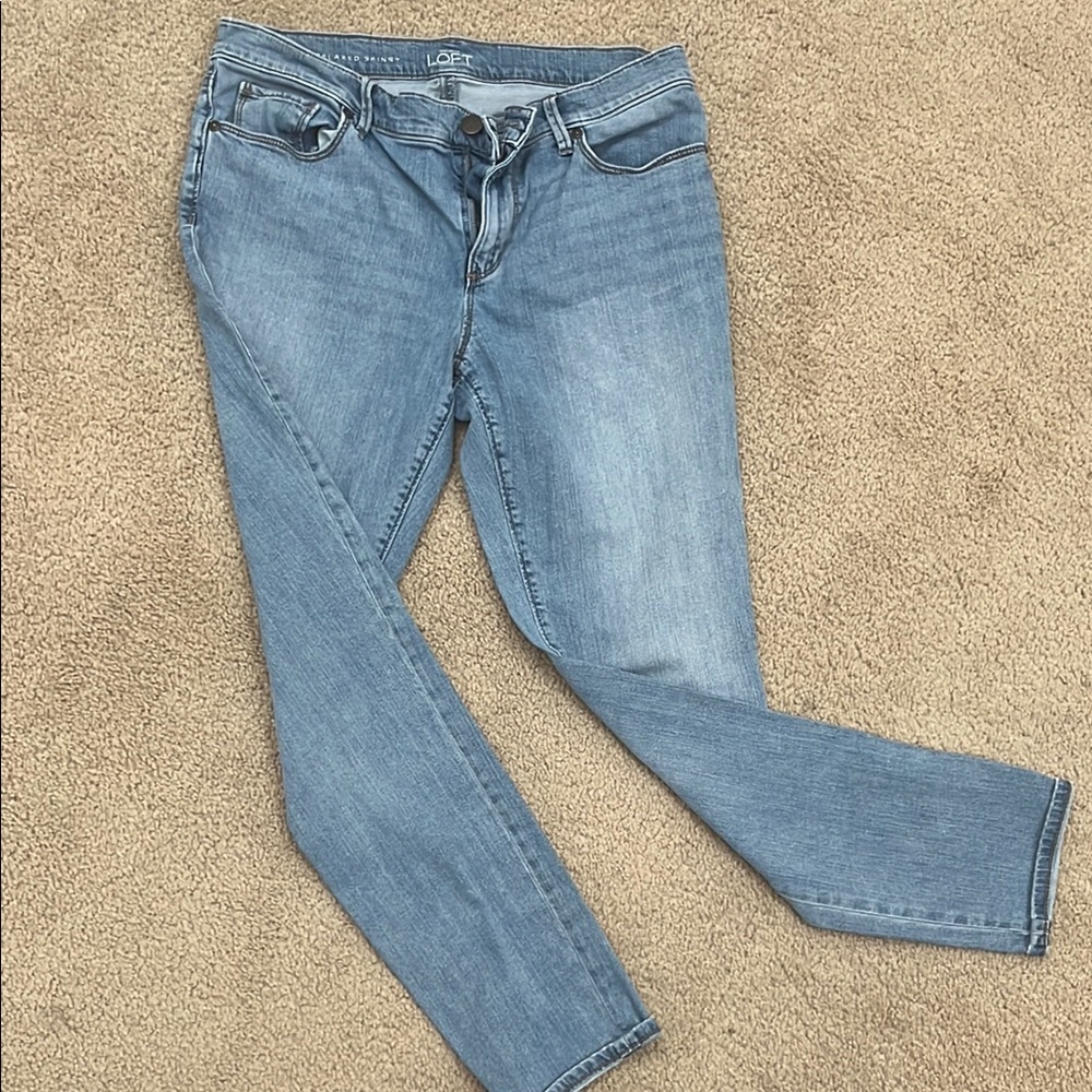 LOFT relaxed skinny fit light medium wash jeans.